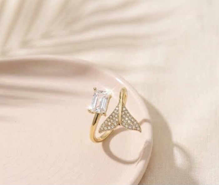 Golden ring with stones