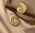 Textured seashell inspired gold earrings with a  pearl