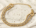 Golden necklace with tiny white stone