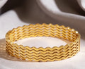 Ripple textured gold bangle
