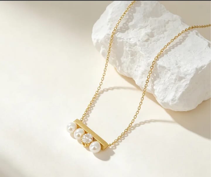 golden pearl and stone necklace